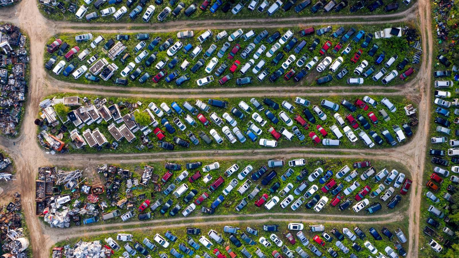 Aerial view of rows of salvage vehicles at an auto and truck salvage yard